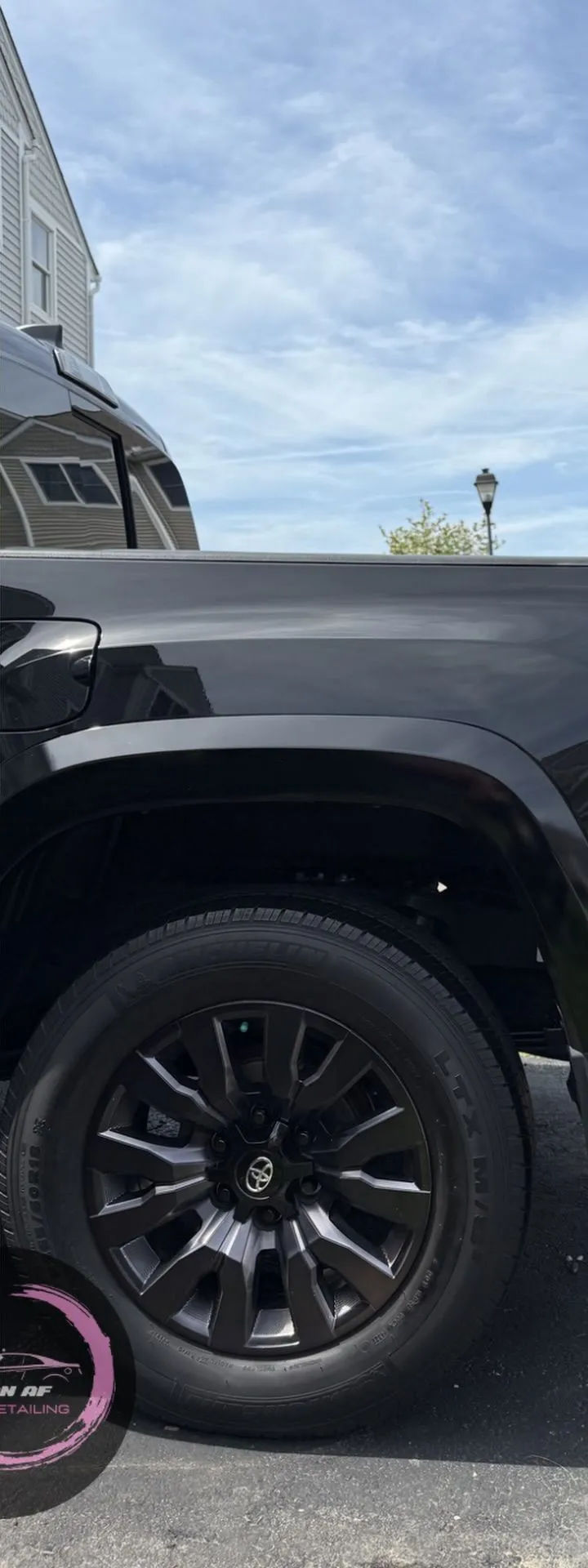 After: the same truck wheel and fender clean and dark
